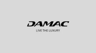 DAMAC logo with the tagline "Live the Luxury" on a gray background.