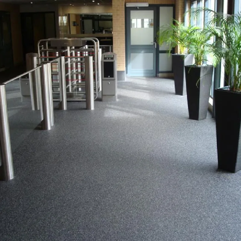 Grey speckled stone carpet floor in a modern entryway