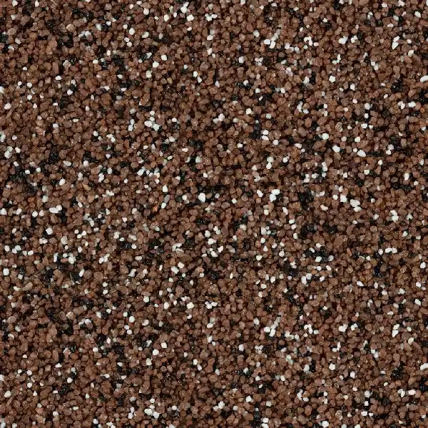 Close-up of brown, black, and white stone carpet flooring texture.